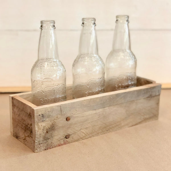 Reclaimed pallet wood centerpiece with 3 glass bottles 